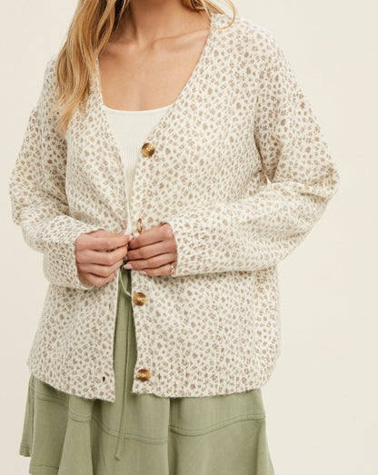 Stay cozy in our beautiful Floral Brushed Cardigan. This versatile cardigan features a cream and taupe floral pattern and a button up design. Wear it open, buttoned up, or layered over other pieces for a perfectly put-together look.