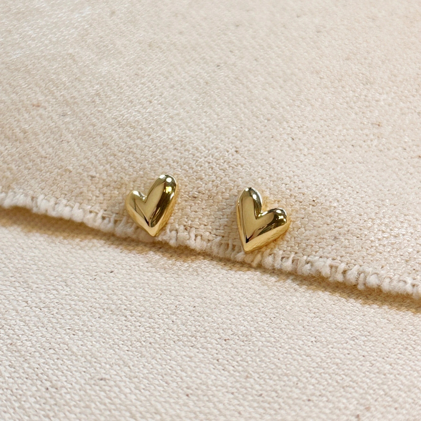 The Heart Stud Earrings are a lovely addition to your jewelry collection. Add a romantic touch to a special occasion, or throw on with your everyday look. 